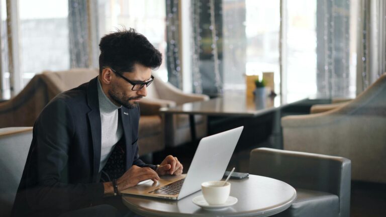 Professional using microlearning on phone during break