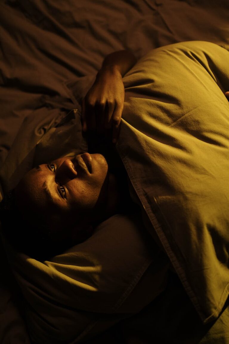 Night shift worker sleeping during the day with blackout curtains